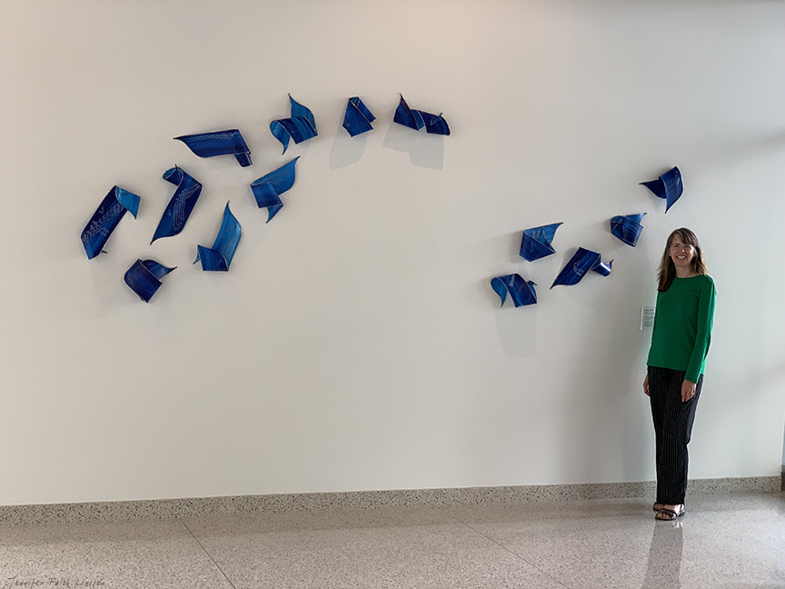 Jennifer Falck Linssen with Ally & Aide wall sculpture at Sentry Insurance, Stevens Point, WI